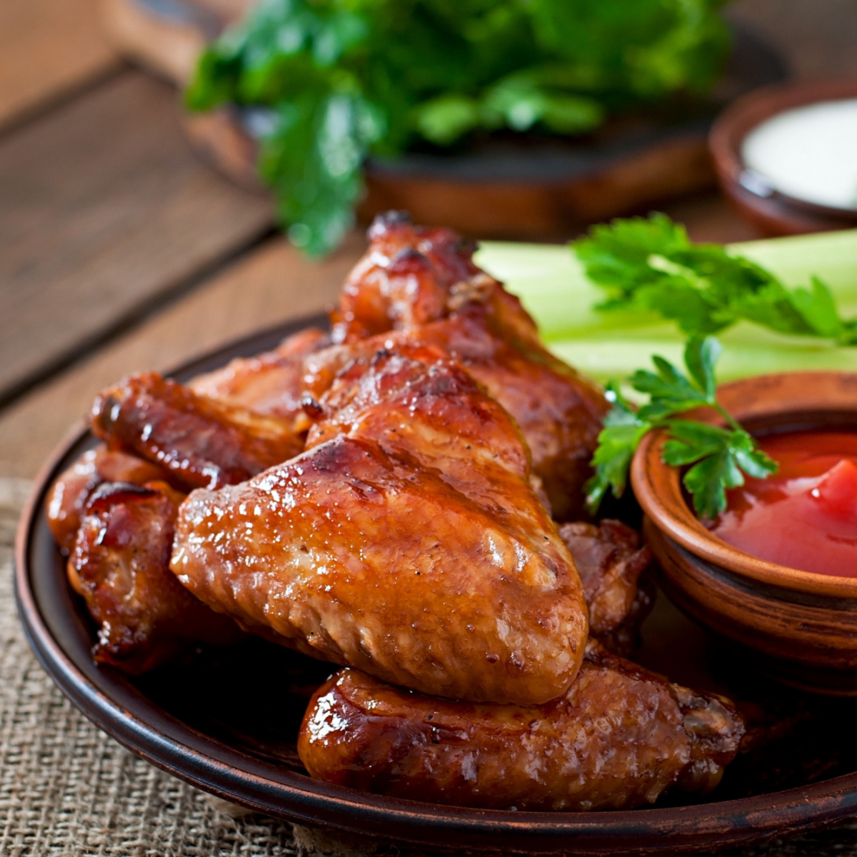 Teriyaki Chicken Wings on brown plate and ketchup