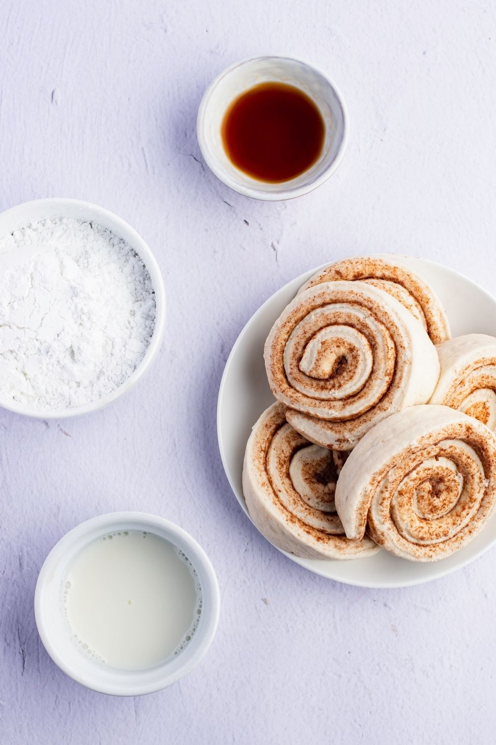 Cinnamon Roll Waffles Ingredients - Refrigerated Cinnamon Rolls, Cream Cheese Icing, Powdered Sugar, Milk, and Vanilla