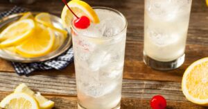 Classic Tom Collins Cocktail with Cherry and Lemon Slice