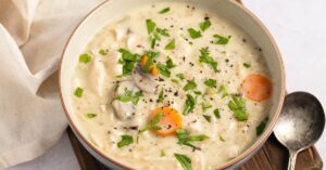 Homemade Bowl of Warm Chicken and Wild Rice Soup with Mushrooms and Carrots