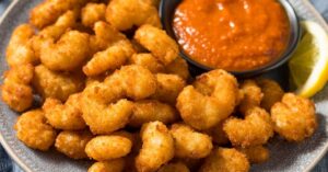 Homemade Crispy and Crunchy Popcorn Shrimp with Sauce and Lemons