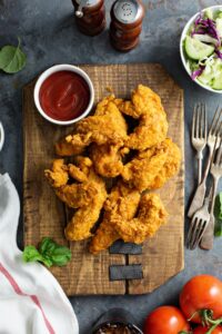 Homemade Chicken Tenders with Vegetables and Ketchup