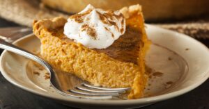 Homemade Pumpkin Pie with Whipped Cream and Cinnamon